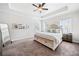 Serene main bedroom with tray ceiling, neutral color palette, and large windows at 234 Fieldbrook Xing, Canton, GA 30115
