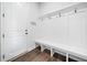 Clean and organized mudroom with built-in bench and coat hooks at 234 Fieldbrook Xing, Canton, GA 30115