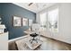 Bright home office featuring a modern desk, statement wall, and large windows at 234 Fieldbrook Xing, Canton, GA 30115