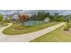 Community tennis court surrounded by manicured landscaping and walking paths at 234 Fieldbrook Xing, Canton, GA 30115