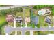 Aerial view of property showcasing spacious yard, landscaping, and neighborhood pool at 2369 Apalachee Crucis Ln, Dacula, GA 30019