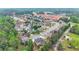 An overhead view of a neighborhood, showing residential streets, houses, green spaces, and community amenities at 2369 Apalachee Crucis Ln, Dacula, GA 30019
