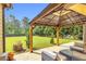 Cozy backyard patio with an outdoor kitchen and ample seating at 2369 Apalachee Crucis Ln, Dacula, GA 30019