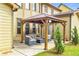 Cozy backyard patio with an outdoor kitchen and ample seating at 2369 Apalachee Crucis Ln, Dacula, GA 30019
