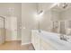 This bathroom features a vanity with double sinks and tiled flooring at 2369 Apalachee Crucis Ln, Dacula, GA 30019