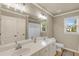 Bathroom featuring double sinks, a large mirror, and a shower/tub combination for convenience at 2369 Apalachee Crucis Ln, Dacula, GA 30019