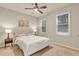 Bedroom with a ceiling fan and two windows at 2369 Apalachee Crucis Ln, Dacula, GA 30019