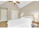 Inviting bedroom with a tray ceiling, ceiling fan, and ensuite bath for comfort and relaxation at 2369 Apalachee Crucis Ln, Dacula, GA 30019