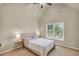 Bedroom with light walls, vaulted ceiling, and view of the outdoors at 2369 Apalachee Crucis Ln, Dacula, GA 30019