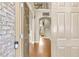 Welcoming foyer with hardwood floors, a view of the upper level, and a 'Welcome' sign at 2369 Apalachee Crucis Ln, Dacula, GA 30019