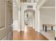 Open foyer featuring hardwood floors, a view of the upper level, and an arched doorway at 2369 Apalachee Crucis Ln, Dacula, GA 30019
