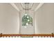 Hallway with statement lighting and a view to the outside at 2369 Apalachee Crucis Ln, Dacula, GA 30019