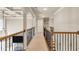 Hallway with coffered ceiling and wrought iron railings at 2369 Apalachee Crucis Ln, Dacula, GA 30019
