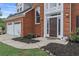 Inviting front entrance with a brick facade, well-maintained landscaping, and a two-car garage at 2500 Grand Manor Ct, Marietta, GA 30068