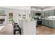 Open concept kitchen with granite counters, sage cabinets and stainless appliances at 2500 Grand Manor Ct, Marietta, GA 30068