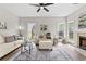 Cozy living room featuring a fireplace, plush seating, and natural light at 2500 Grand Manor Ct, Marietta, GA 30068