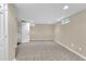 Finished basement offering tile flooring, a window, and access to a full bathroom, suitable for various activities at 3175 Old Jonesboro Rd, Fairburn, GA 30213
