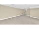 Large basement area with tile flooring, neutral walls, and staircase access, ideal for versatile use and storage at 3175 Old Jonesboro Rd, Fairburn, GA 30213