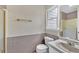 Bathroom featuring a marble sink, and shower with gold hardware, and tile-lined walls at 3175 Old Jonesboro Rd, Fairburn, GA 30213
