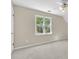 Bedroom with neutral walls, carpet, a ceiling fan, and a large window with a view at 3175 Old Jonesboro Rd, Fairburn, GA 30213