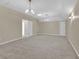 Spacious bonus room featuring neutral walls, carpeting, and lighting fixtures at 3175 Old Jonesboro Rd, Fairburn, GA 30213