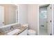 Updated bathroom with a granite countertop vanity at 3773 Sarahs Ln, Tucker, GA 30084