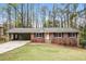 Charming single-story brick home with a welcoming front yard and a convenient carport at 3773 Sarahs Ln, Tucker, GA 30084