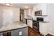 Modern kitchen with granite countertops, stainless steel appliances, and a center island at 3773 Sarahs Ln, Tucker, GA 30084