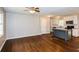 Open-concept living room with hardwood floors seamlessly connects to the kitchen area at 3773 Sarahs Ln, Tucker, GA 30084