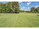 Expansive fenced backyard offering privacy and ample space for recreation and outdoor activities at 3557 Bill Gardner Pkwy, Locust Grove, GA 30248