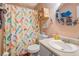 Bright bathroom featuring a vanity with solid surface counter and mermaid shower curtain at 3557 Bill Gardner Pkwy, Locust Grove, GA 30248