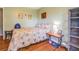 Cozy bedroom with hardwood floors, decor, and ample natural light at 3557 Bill Gardner Pkwy, Locust Grove, GA 30248