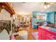 Bright living room features a fireplace and open view to kitchen at 3557 Bill Gardner Pkwy, Locust Grove, GA 30248