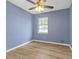Bedroom features a ceiling fan for added comfort and natural light from window making the space feel bright and airy at 149 Roy Huie Rd, Riverdale, GA 30274