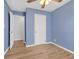 Bedroom features neutral walls, wood-look floors, closet and ceiling fan, offering a comfortable retreat at 149 Roy Huie Rd, Riverdale, GA 30274