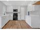 Modern kitchen with white cabinets, stainless steel appliances, and granite countertops at 149 Roy Huie Rd, Riverdale, GA 30274