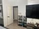 Bedroom featuring a large TV and modern decor at 1506 Ravenel Rd, Conley, GA 30288