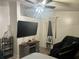 Relaxing bedroom features a large TV and modern massage chair at 1506 Ravenel Rd, Conley, GA 30288