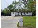 Charming single-story home with a covered front porch and a well-maintained lawn at 1506 Ravenel Rd, Conley, GA 30288