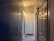 Hallway with blue walls and doors at 1506 Ravenel Rd, Conley, GA 30288