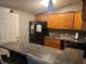 Kitchen with granite countertops and a black refrigerator at 1506 Ravenel Rd, Conley, GA 30288