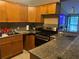 Spacious kitchen featuring stainless steel appliances and granite countertops at 1506 Ravenel Rd, Conley, GA 30288