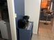 This laundry area includes a utility shelf and a washer at 1506 Ravenel Rd, Conley, GA 30288