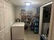 Walk-in pantry featuring metal shelving, stocked with groceries and household items at 1506 Ravenel Rd, Conley, GA 30288