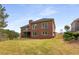 Large backyard with mature trees and green space, perfect for outdoor enjoyment at 4457 Equity Ct, Ellenwood, GA 30294