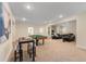 Large finished basement with a pool table and lounge seating at 4457 Equity Ct, Ellenwood, GA 30294