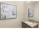 Bathroom with granite counters and framed art at 4457 Equity Ct, Ellenwood, GA 30294