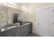Elegant bathroom with dual vanities, granite countertops, and modern fixtures offers both style and functionality at 4457 Equity Ct, Ellenwood, GA 30294