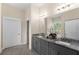 Elegant bathroom with dual vanities, granite countertops, and modern fixtures offers both style and functionality at 4457 Equity Ct, Ellenwood, GA 30294