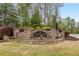 Stone entrance to Thurgood Estates, showcasing the community's upscale ambiance at 4457 Equity Ct, Ellenwood, GA 30294